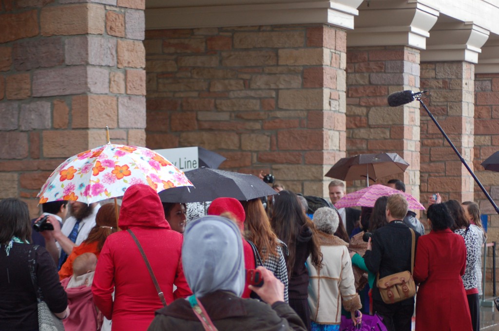 Ordain Women supporters and others cluster around the Tabernacle's door 15 at the head of the standby line.