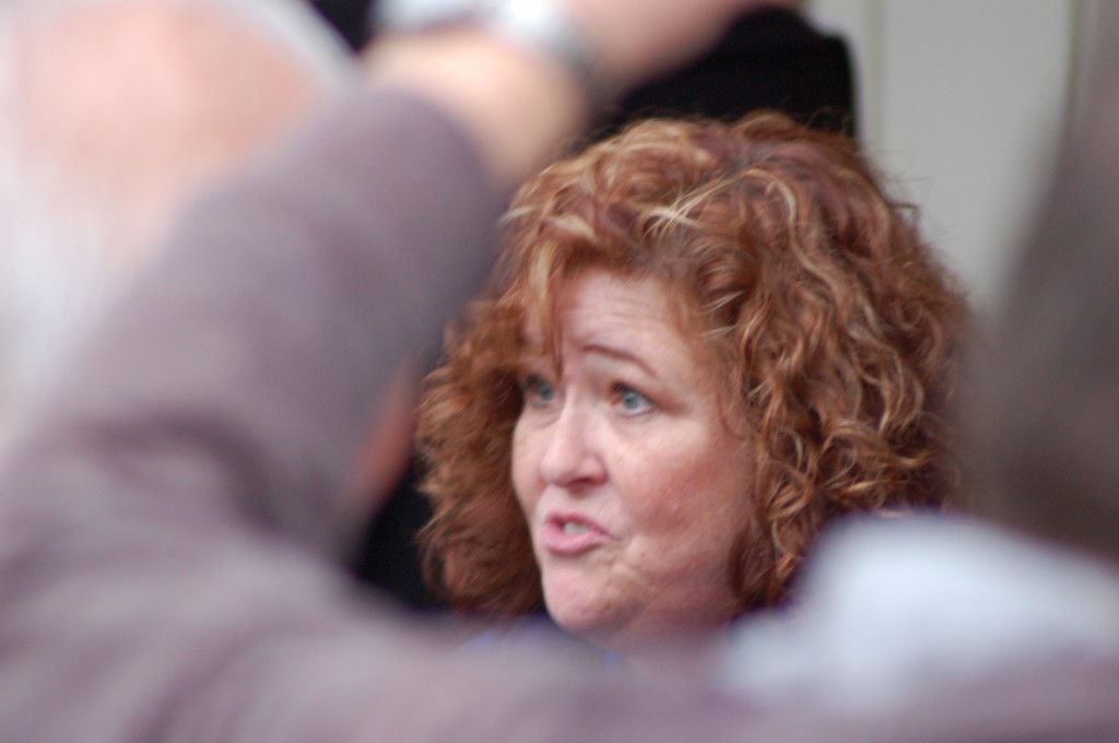 A Church official takes time to greet each of the Ordain Women members individually.