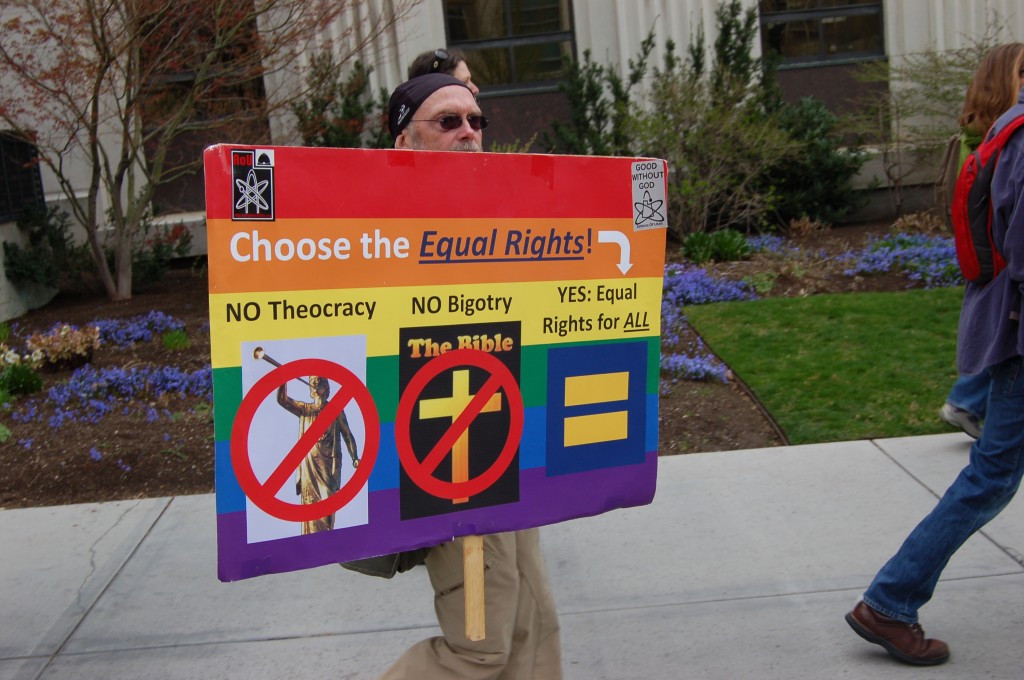 One of two signs carried by the atheists as they marched around Temple Square.