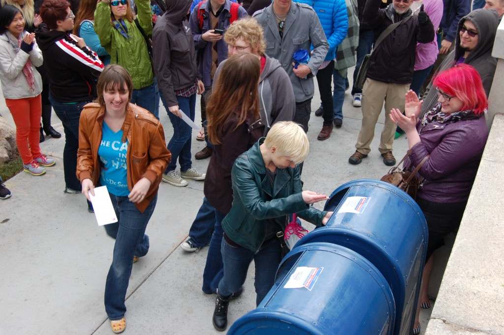 Depositing letters of resignation into mail boxes.