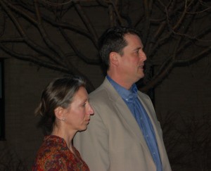 John Dehlin addresses those at the vigil with his wife, Margi, at his side.