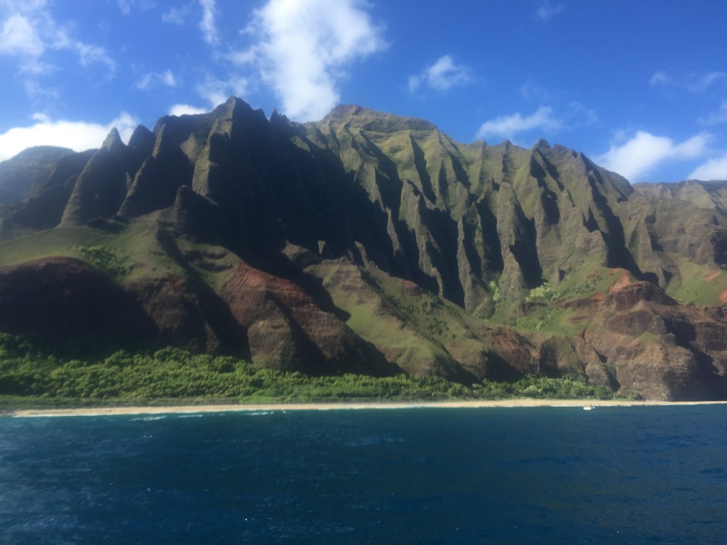Along the Napali coast, which is only easily accessible by boat or helicopter. The 1,500 to 3,500 foot cliffs are stunning and present a natural barrier to driving around the island.